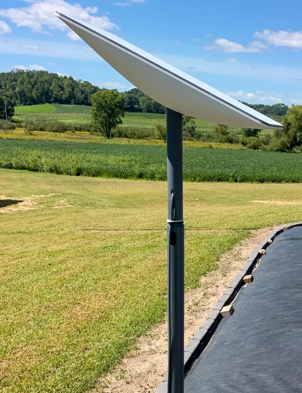 A Starlink satellite dish mounted on a pole