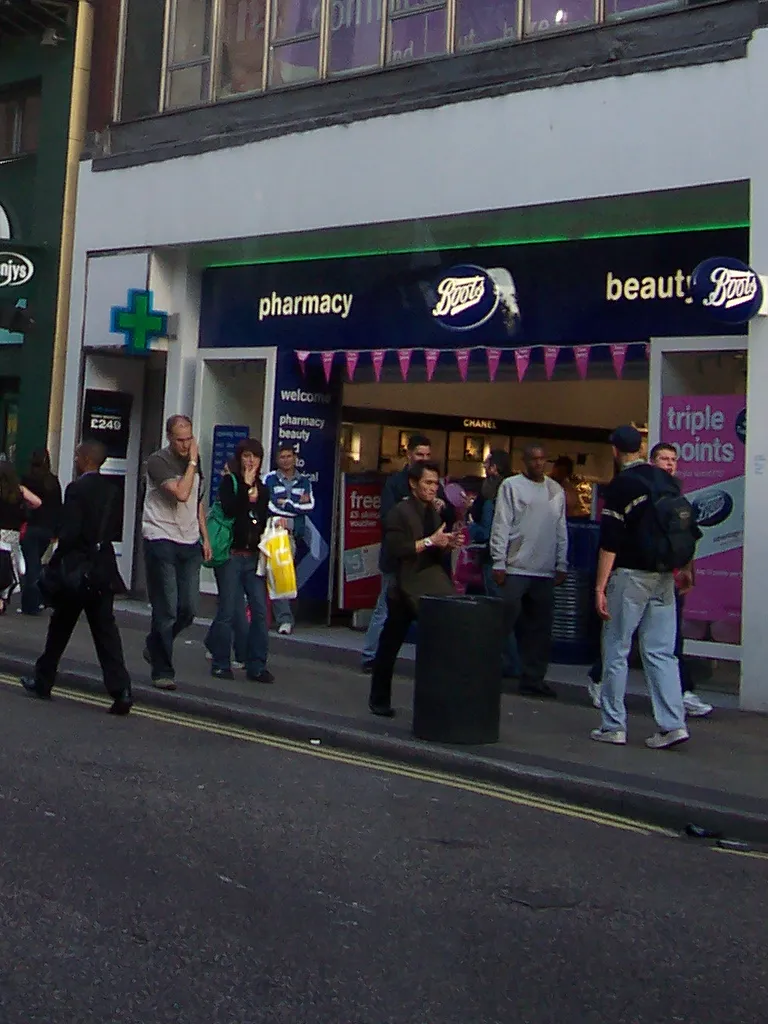 A Boots pharmacy and beauty storefront on a London high street with Boots signage