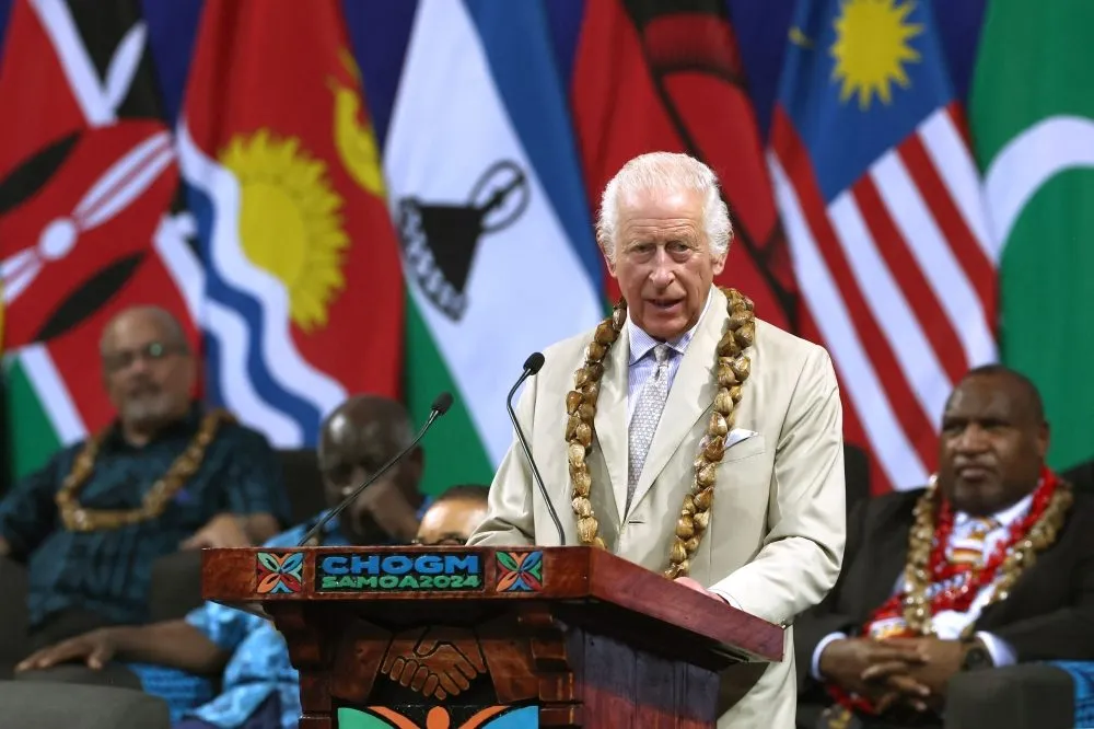 King Charles delivering a speech at the CHOGM Samoa 2024 podium