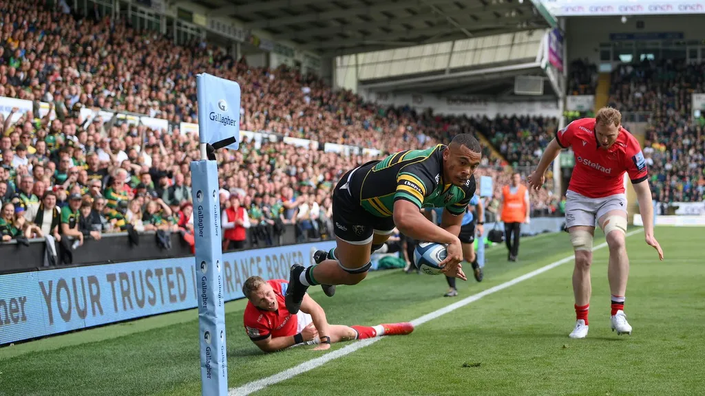 Northampton Saints player diving to score a try at Franklins Gardens