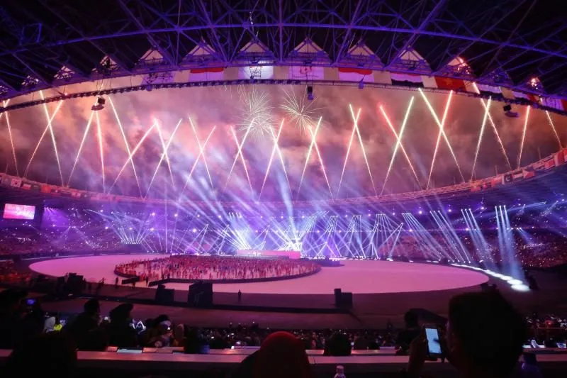 Fireworks light up the sky above the stadium during the Asian Games closing ceremony