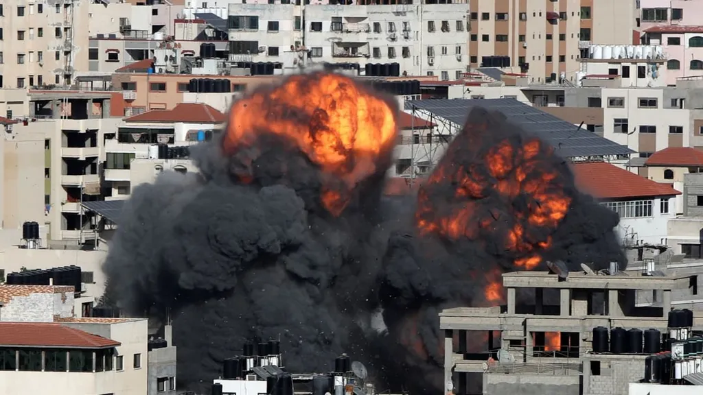 A massive explosion and smoke plume over buildings in Gaza