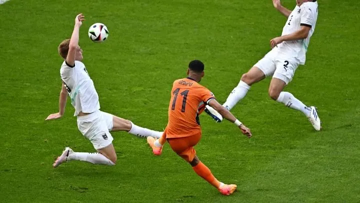 Cody Gakpo volleys for the Netherlands against Germany