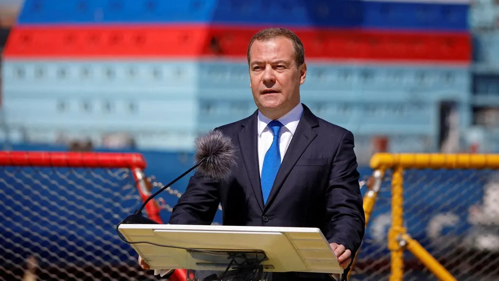 Former Russian president Dmitry Medvedev speaks at a lectern