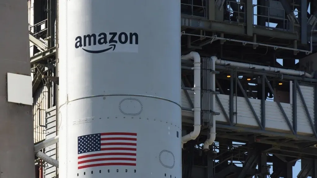 An Amazon-branded rocket fairing stands on the launch pad